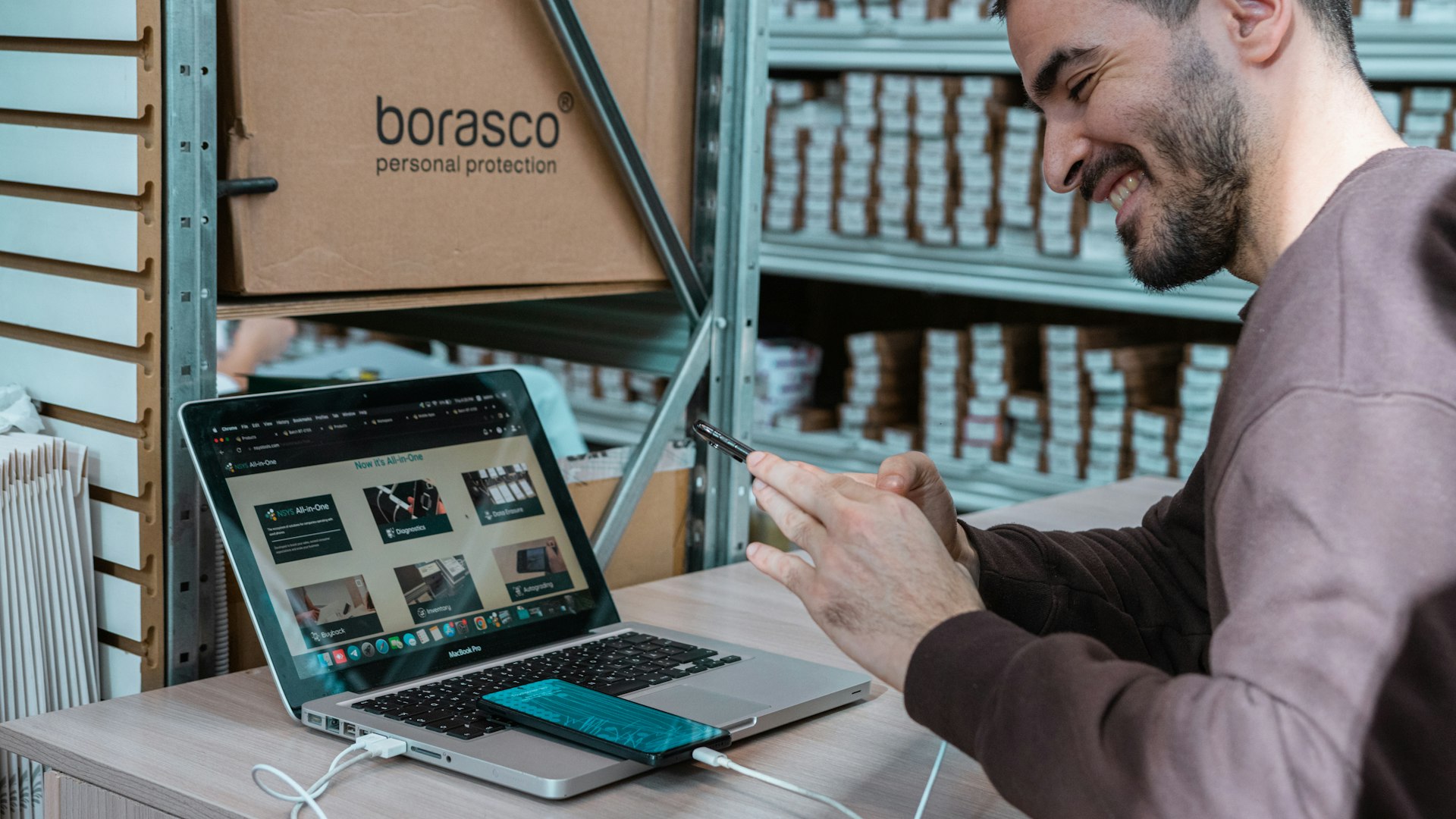 Small business owner reviewing website conversion data on a laptop in good natural light