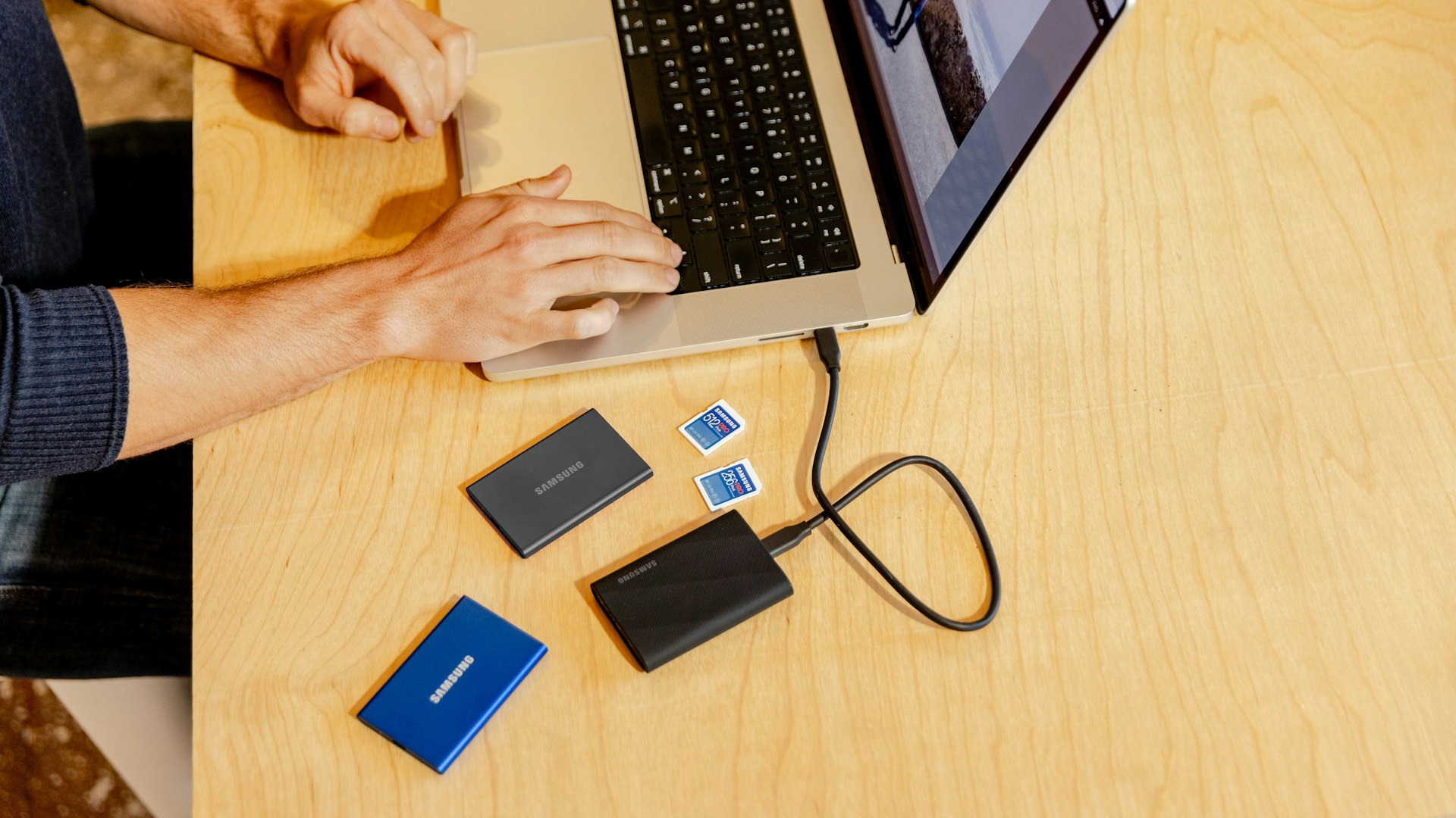 Small business owner comparing website hosting options on a laptop