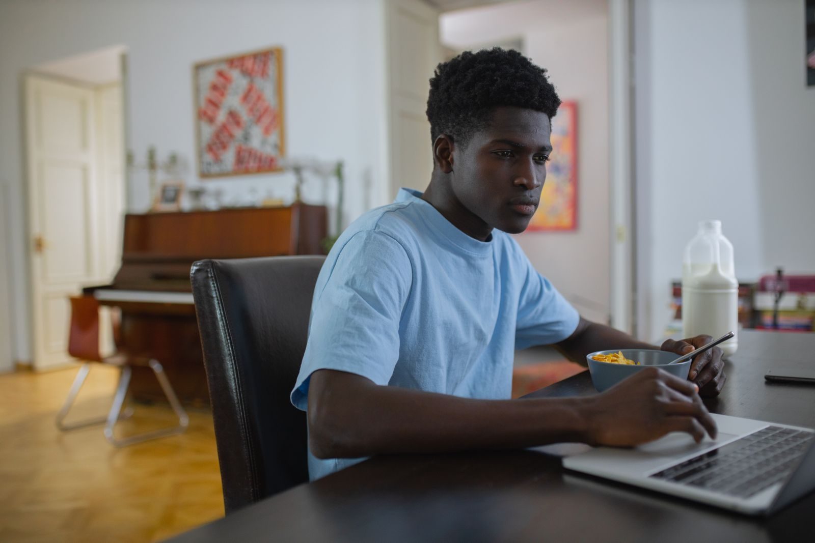 A person searching on Google on a laptop