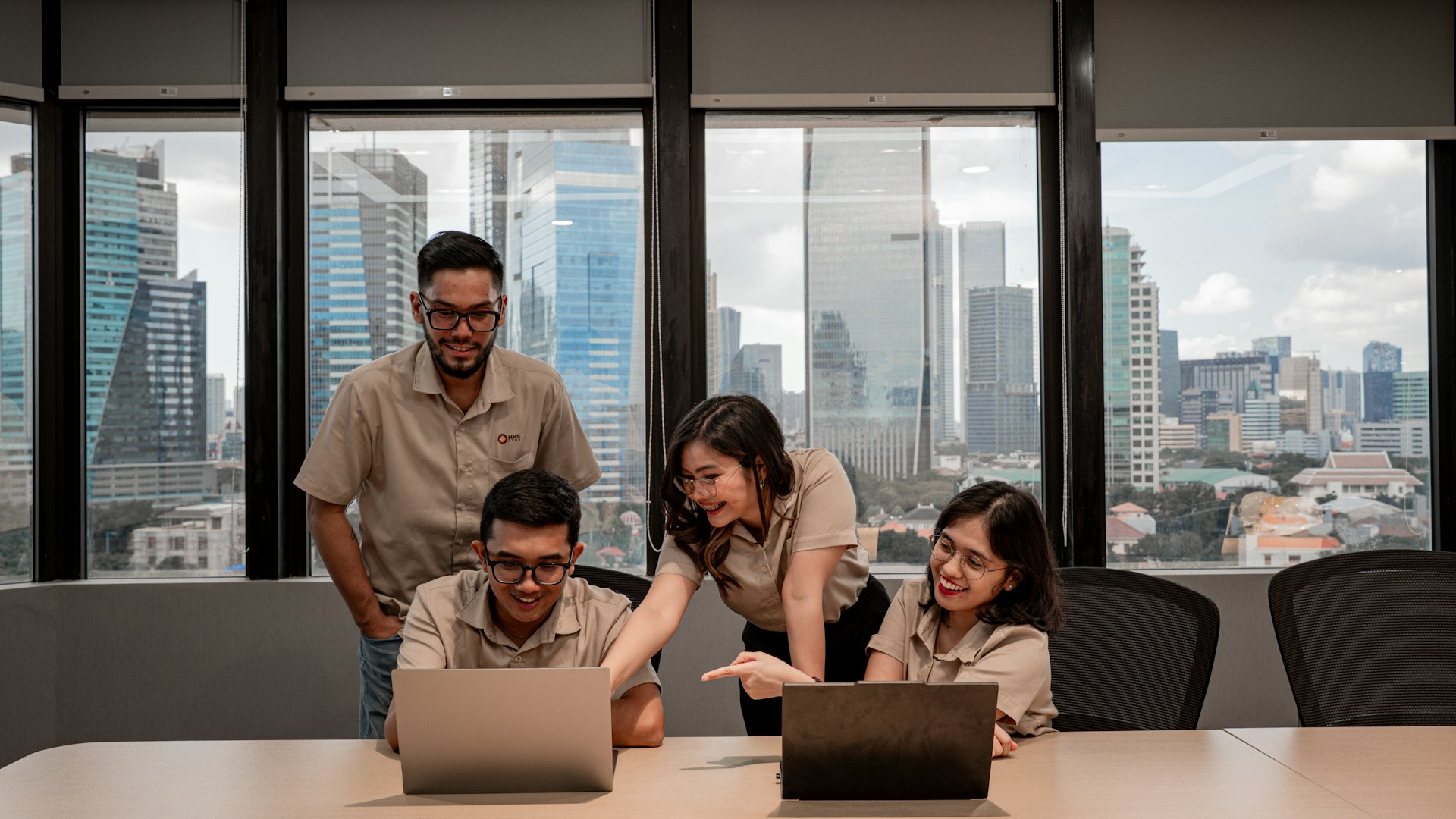 Small team reviewing a website recovery plan together in a bright modern office